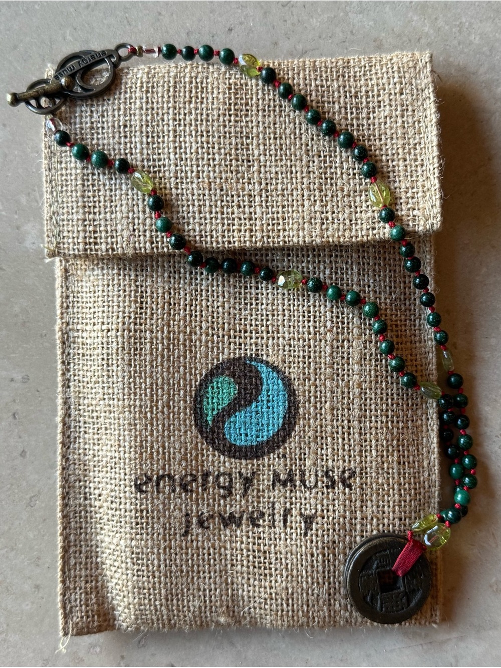 ENERGY MUSE prosperity necklace with Peridot and Coin Charm
